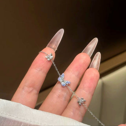 Close-up of the enamel butterfly and crystal flower charms