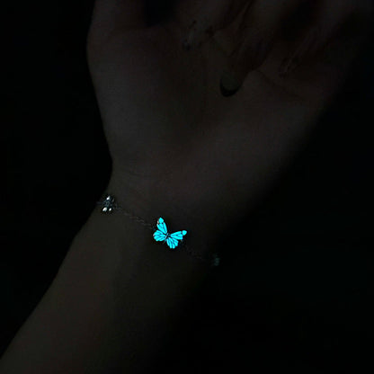 Butterfly bracelet glowing on the wrist at night